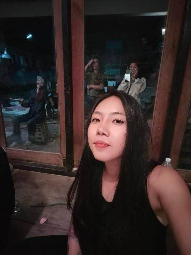 Selfie by Boat, the festival organizer, taken during the performance. Her face is very smooth and flawless