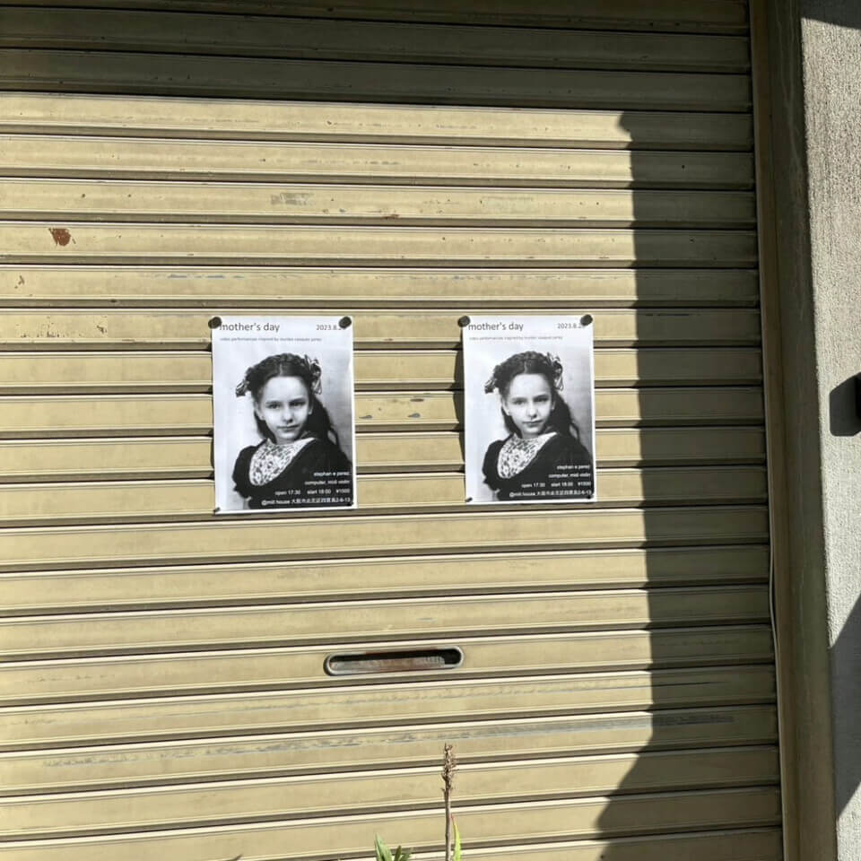 two grayscale flyers stuck to the garage door of miit house, the venue
